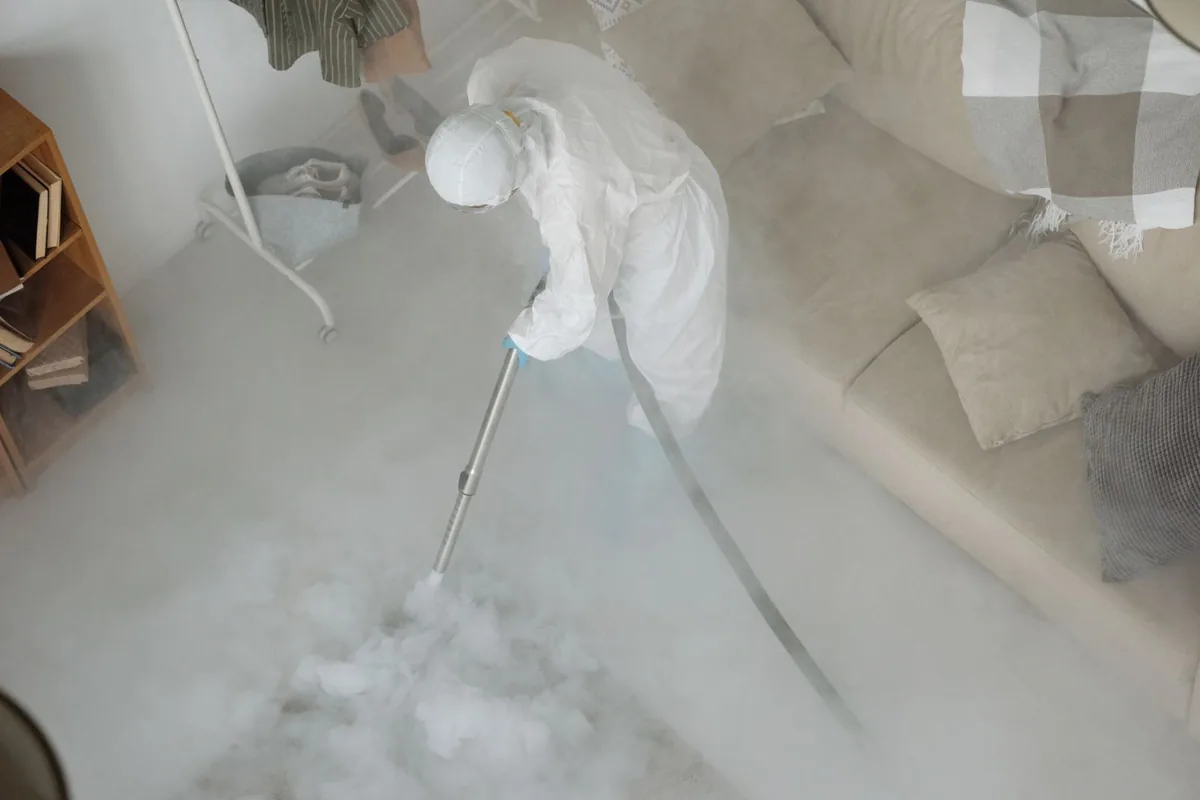 Biohazard cleanup technician in protective equipment, East Hemet, CA